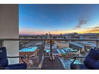 Enjoy breathtaking city views from this condo's balcony, featuring comfortable seating and a modern design at 150 Las Vegas Blvd # 1912, Las Vegas, NV 89101