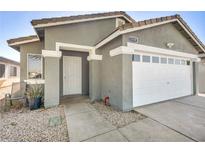 Charming single-story home featuring a two-car garage and desert landscaping at 1714 Ringe Ln, Las Vegas, NV 89156