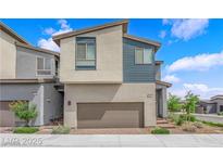 Charming two-story home featuring a two-car garage and modern architectural details at 3192 Timorasso Ave, Henderson, NV 89044