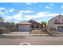 Charming single-story home featuring desert landscaping, a gated entrance, and a two-car garage at 3443 Citruscedar Way, North Las Vegas, NV 89032