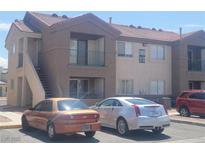 Charming apartment complex featuring a 2 story building and a balcony at 3965 Rebecca Raiter Ave # 201, Las Vegas, NV 89110