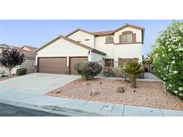 Charming two-story home with desert landscaping, a three-car garage, and a welcoming entrance at 4114 Jessica Marie St, North Las Vegas, NV 89032