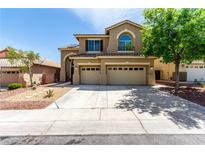 Charming two-story home with a three car garage and low maintenance desert landscaping at 432 Emerald Heights St, Las Vegas, NV 89144