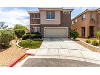 Inviting two-story home with a well-maintained lawn and a spacious two-car garage at 4705 Delicate Arch Ct, North Las Vegas, NV 89031