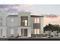 Modern home features a stylish stone facade, balcony, neutral color palette, and well-maintained landscaping at 5761 Crenellated St # Lot 60, Las Vegas, NV 89148