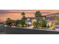 Stunning exterior featuring professional landscaping, mature trees, and a circular driveway at 584 Saint Croix St, Henderson, NV 89012