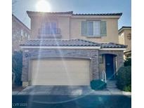 Two-story home with stone accents and a two-car garage at 7563 Captain Lord Ct, Las Vegas, NV 89166