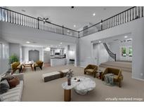 Bright, open-concept living room featuring high ceilings and contemporary furnishings at 8809 Barium Rock Ave, Las Vegas, NV 89143