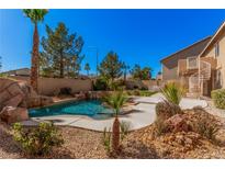 Beautiful backyard pool and spa surrounded by desert landscaping at 8809 Barium Rock Ave, Las Vegas, NV 89143