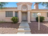 Charming single-story home with desert landscaping and a covered entryway at 1411 Di Blasi Dr # 104, Las Vegas, NV 89119