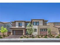 Two-story home featuring modern design elements, a two-car garage and manicured landscaping at 201 Carmel Sky St, Las Vegas, NV 89138