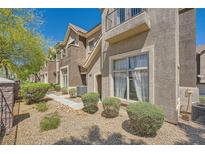 Charming townhouse featuring well-maintained landscaping and neutral stucco facade at 2761 Red Vista Ct, Henderson, NV 89074