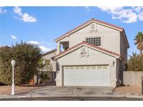 Charming two-story home with a well-manicured lawn, two-car garage and beautiful landscaping at 3632 Julia Waldene Ct, Las Vegas, NV 89129