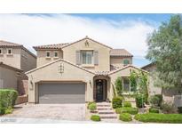 Charming two-story home features desert landscaping and a tiled roof at 3698 Regatta Landing Dr, Las Vegas, NV 89141