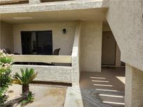Inviting condo front entry with a small patio and desert landscaping at 3771 Desert Marina Dr # 95, Laughlin, NV 89029