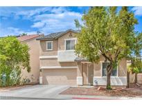 Charming two-story home featuring desert landscaping, neutral stucco, and a two-car garage at 5024 Granite Creek Ct, Las Vegas, NV 89131