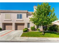 Charming two-story townhouse with a well-maintained front yard and two-car garage at 509 Chestnut View Pl, Henderson, NV 89052