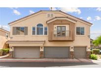 Inviting townhome showcasing a three-car garage and an appealing exterior design at 6029 Mustang Breeze Trl # 101, Henderson, NV 89011