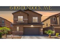 Charming two-story home features a stone-accented facade and a well-maintained front yard with palm tree at 6409 Dundock Ave, Las Vegas, NV 89122