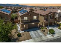 Charming two-story home featuring a neutral color palette, solar panels, and low-maintenance landscaping at 6409 Dundock Ave, Las Vegas, NV 89122