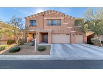 Inviting two-story home featuring a well-maintained front yard and a convenient two-car garage at 8137 Cape Flattery Ave, Las Vegas, NV 89147