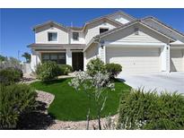 Charming two-story home featuring a well-manicured lawn and attached two-car garage at 10591 Haywood Dr, Las Vegas, NV 89135