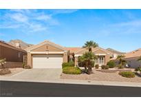 Charming single-story home with desert landscaping, tile roof, and a two-car garage at 10712 Back Plains Dr, Las Vegas, NV 89134
