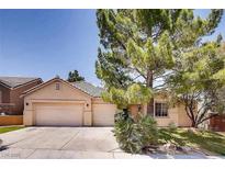 Charming single-story home with a three-car garage and mature landscaping at 1135 Hidden Mist St, Henderson, NV 89052