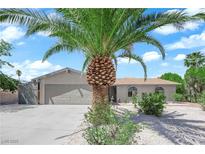 Charming single story home showcasing beautiful palm tree and desert landscaping at 4508 Rip Van Winkle Ln, Las Vegas, NV 89102