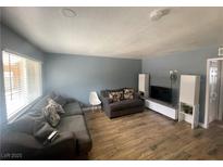 Cozy living room featuring plush seating, wooden floors, and a modern entertainment center at 501 S Maryland Pkwy # C17, Las Vegas, NV 89101
