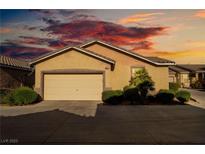 Charming single-story home featuring desert landscaping and a two-car garage at 6622 Black Oil Dr, Las Vegas, NV 89122