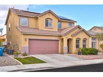Charming two-story home with a spacious two-car garage, desert landscaping, and solar panels at 7129 Dillseed Dr, Las Vegas, NV 89131
