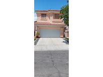 Charming two-story home with a tile roof and a two-car garage in a well-maintained neighborhood at , Henderson, NV 89052