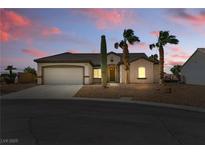 Charming single-story home with desert landscaping, and a convenient attached two-car garage at 2612 Dearport Ct, Henderson, NV 89052