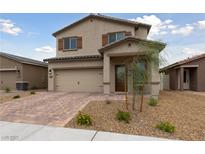 Charming two-story home featuring a neutral color scheme and a well-maintained, inviting front yard at 2729 Pavehawk Way, Las Vegas, NV 89156