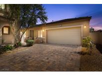 Cozy single-story home featuring a spacious two-car garage and a beautifully paved driveway at 3521 Discovery Downs Ct, North Las Vegas, NV 89081