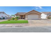 Charming single story home featuring a two-car garage and manicured front yard at 452 Waterwheel Falls Dr, Henderson, NV 89015