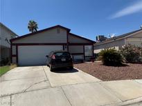 Charming single-story home featuring a two-car garage and a well-maintained front yard at 5065 Celebrity Cir, Las Vegas, NV 89119