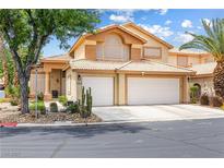 Charming two-story home featuring a two-car garage and desert landscaping in the front yard at 5449 Desert Spring Rd, Las Vegas, NV 89149