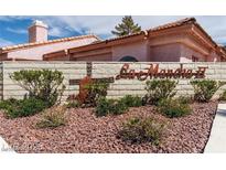 Welcoming community entrance sign with manicured landscaping and desert rock at 613 Cervantes Dr, Henderson, NV 89014