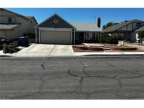 Charming one-story home featuring a two-car garage and a well-maintained front yard at 6361 Copperfield Ave, Las Vegas, NV 89108
