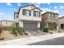 Charming two-story home with a two-car garage and beautiful landscaping at 6611 Dove Point Pl, Las Vegas, NV 89130