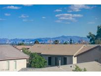 Scenic view of the Las Vegas city skyline with mountains and clear blue sky, taken from a residential neighborhood at 6844 Tropicaire St, Las Vegas, NV 89149