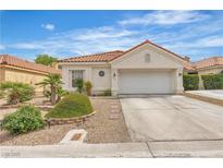 Charming single-story home with a two-car garage and desert landscaping at 7929 Ben Hogan Dr, Las Vegas, NV 89149