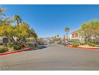 Gated community entrance featuring well-maintained landscaping and secure access for residents at 950 Seven Hills Dr # 2014, Henderson, NV 89052