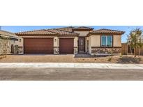 Beautiful single-story home with a two-car garage and a nicely landscaped front yard at 1220 Eva Creek Dr # 35, North Las Vegas, NV 89084