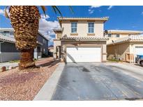 Charming two-story home features a two-car garage and low-maintenance desert landscaping at 1360 Angel Falls St, Las Vegas, NV 89142
