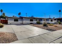 Charming single-story home with a spacious driveway and desert landscaping at 1631 Ottawa Dr, Las Vegas, NV 89169