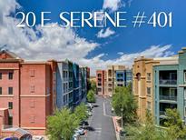 Beautiful complex at 20 E Serene with colorful buildings, manicured trees and a gorgeous sky at 20 E Serene Ave # 401, Las Vegas, NV 89123