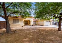 Charming single-story home with desert landscaping and covered porch at 3481 Winery Rd, Pahrump, NV 89048
